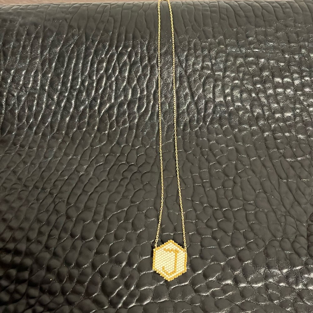 Necklace with a “J” initials